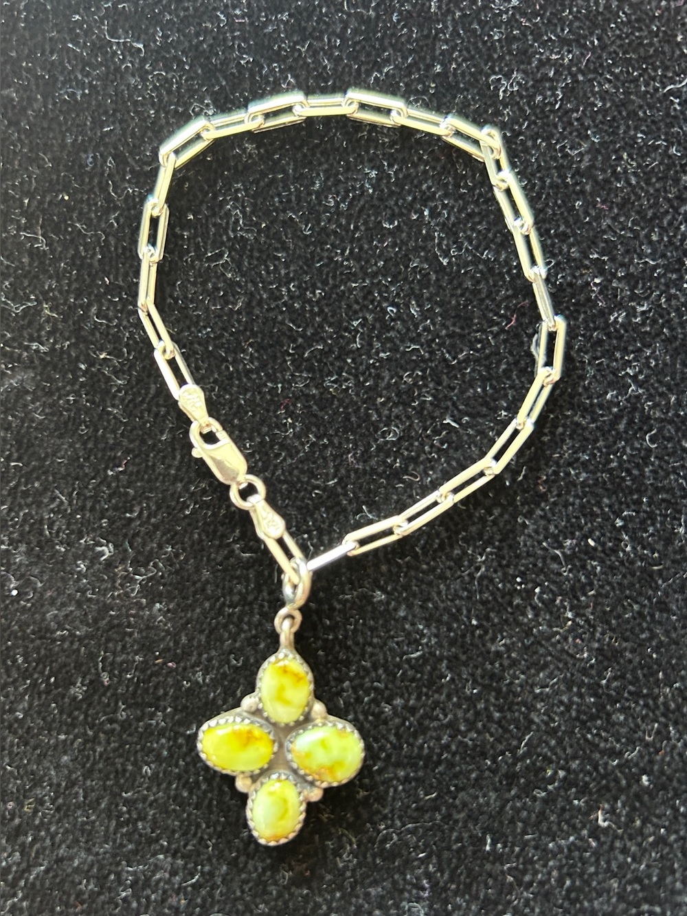 Palomino turquoise charm and sterling silver paperclip chain bracelet.